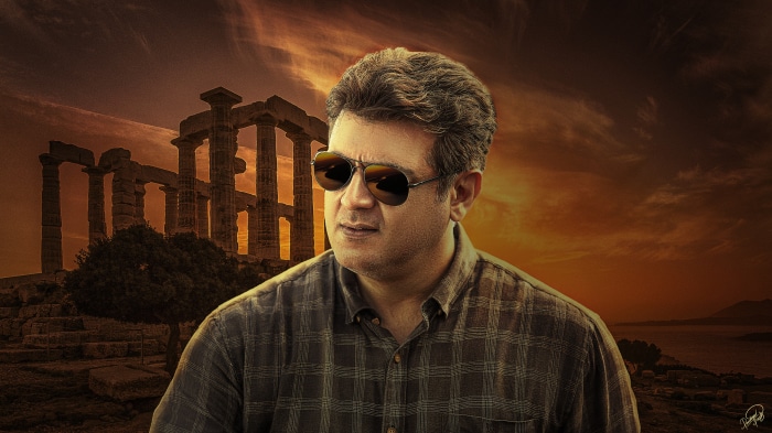 Ajith Kumar in front of ancient ruins at sunset