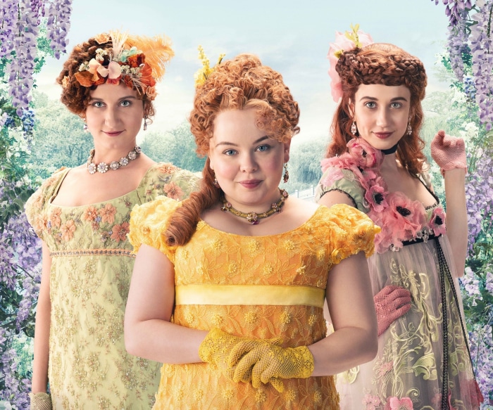 Three women from Bridgerton in Regency-era dresses