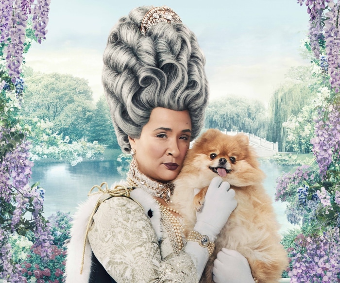 Queen Charlotte from Bridgerton holding a Pomeranian dog