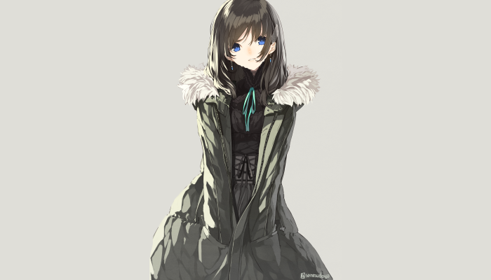 Girl with blue eyes and dark hair wearing a coat