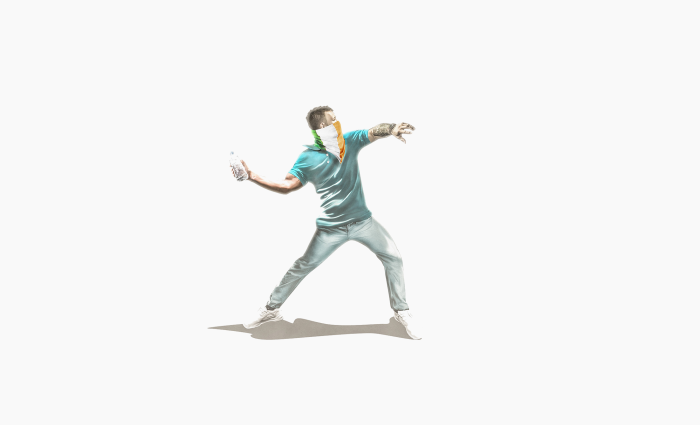 Man throwing a bottle with Irish flag bandana