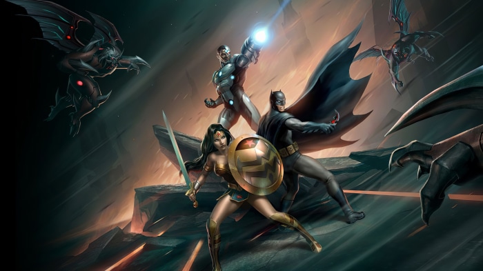 Batman, Wonder Woman, and Cyborg fighting alien creatures