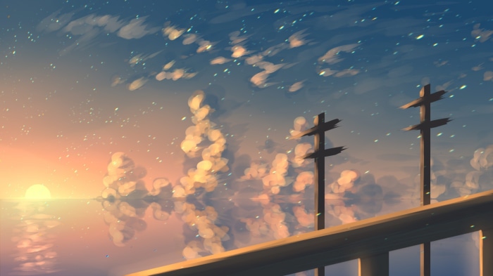 Sunset over the ocean with telephone poles
