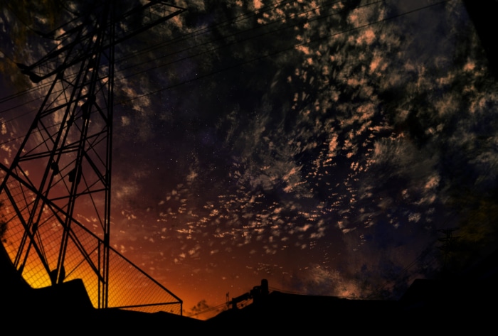 Silhouette of power lines against a dramatic night sky