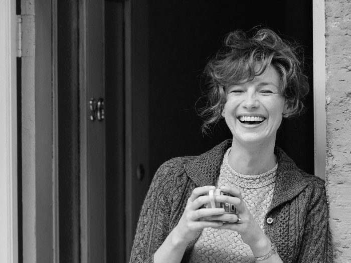 Caitriona Balfe laughing with a mug
