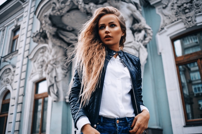 Woman in leather jacket and jeans