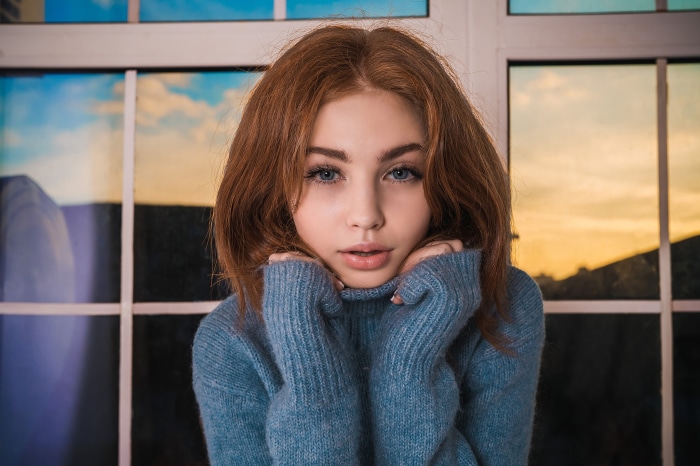 Redhead girl in blue sweater