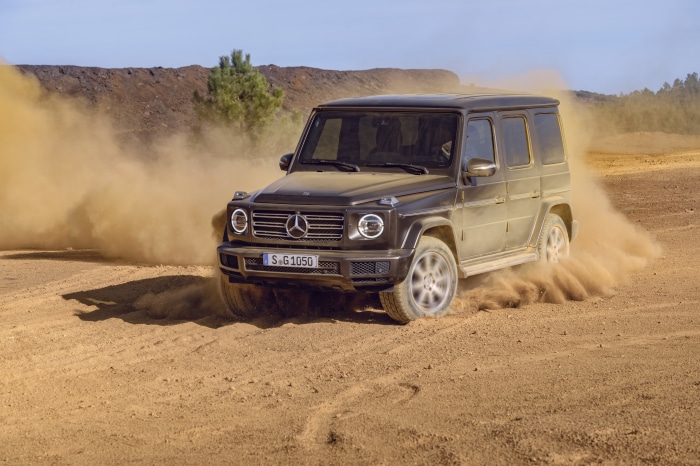 Mercedes-Benz G-Class driving through dust