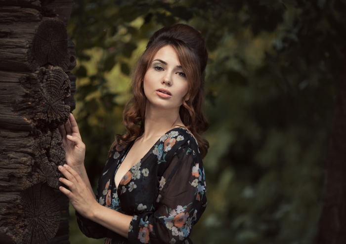 Woman with brunette hair in a floral dress