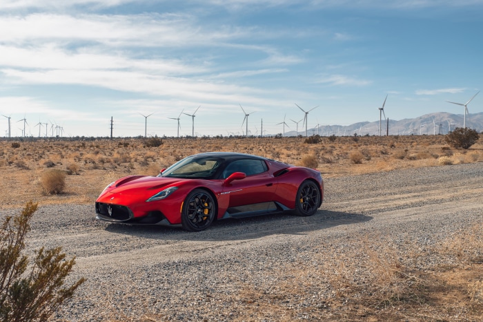 Red Maserati MC20 Supercar in Desert with Wind Turbines