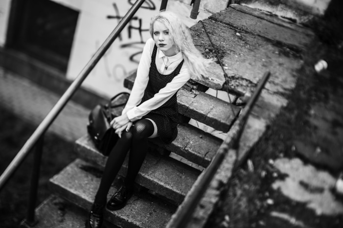 Model sitting on stairs