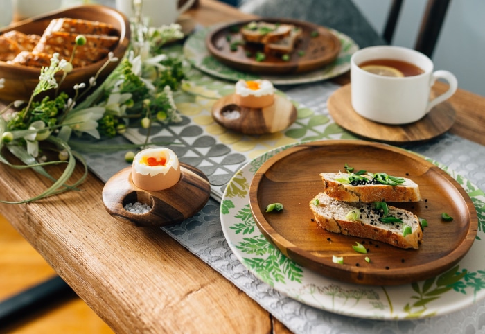 Breakfast table setting with eggs and bread