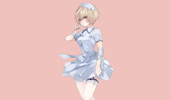 Nurse girl with blonde hair holding a syringe