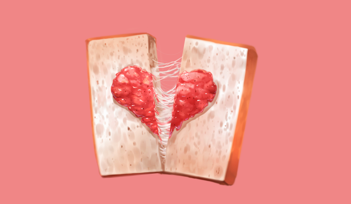 Heart-shaped cheese and jam sandwich