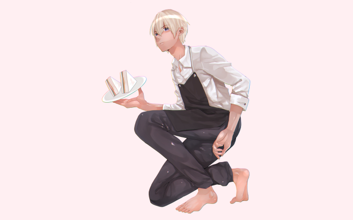 Blonde boy in apron holding sandwiches
