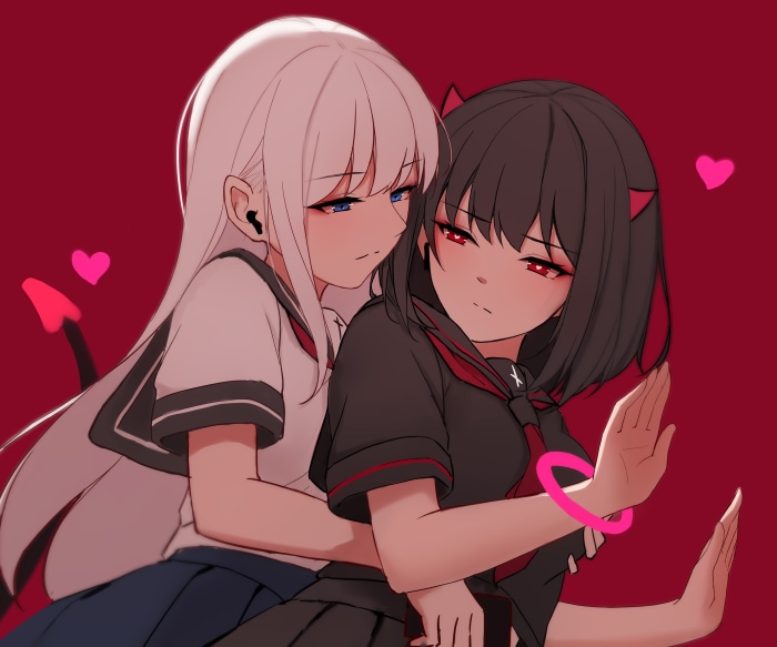 Two girls in school uniforms embracing