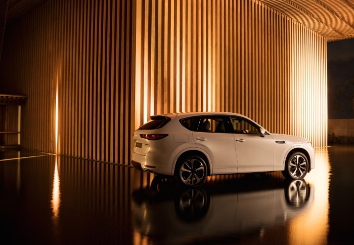 White Mazda CX-60 SUV parked indoors