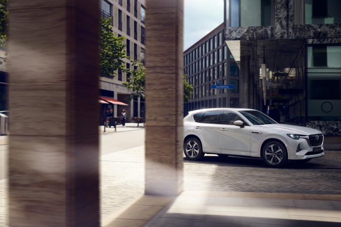 White Mazda CX-60 SUV on a City Street