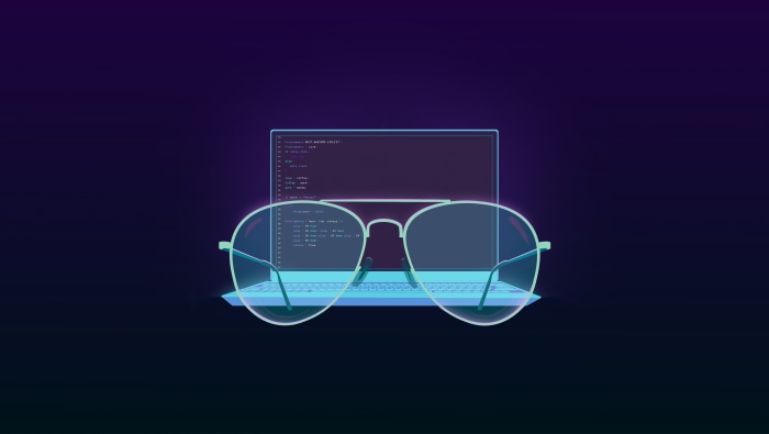 Laptop with code and glasses