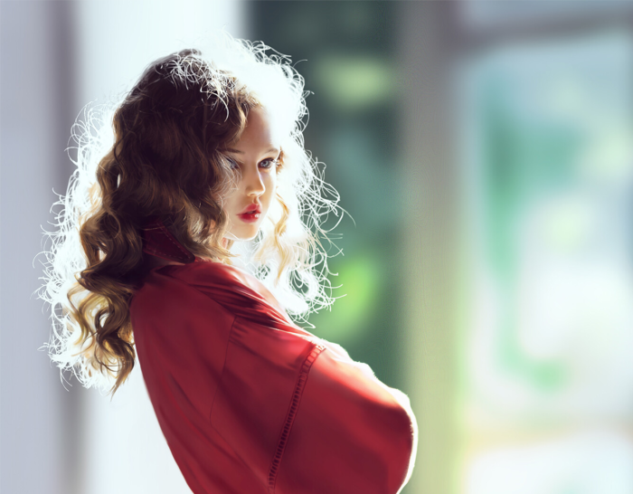 Young girl in red robe with curly hair