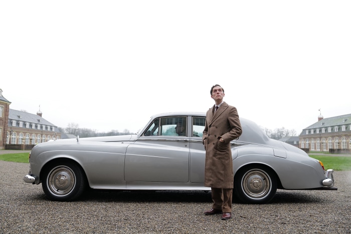 Jack Farthing in a vintage car