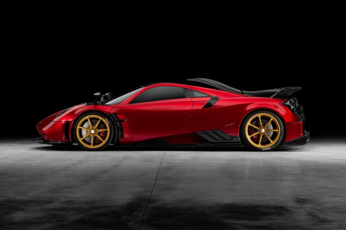 Red Pagani Imola supercar with gold wheels