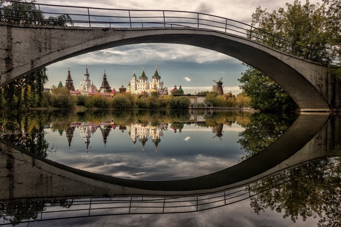 Izmaylovo Kremlin reflected in water under a bridge in Russia