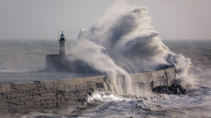 Lighthouse in a Storm with Crashing Waves