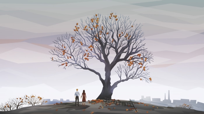 Couple holding hands by a bare tree