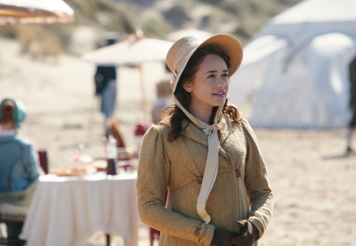 Woman in straw hat on a beach