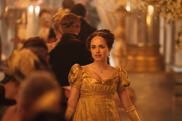 Woman in gold dress at a ball