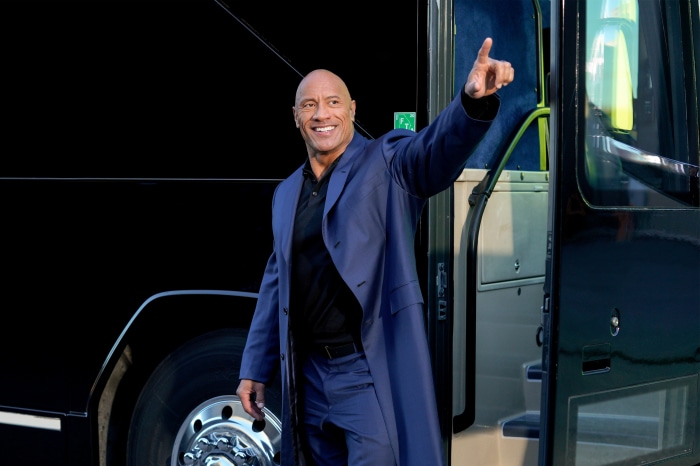 Dwayne Johnson exiting a bus