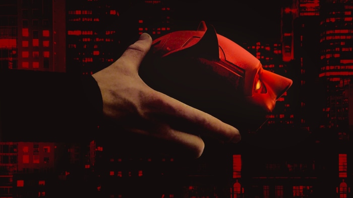 Daredevil Mask Held by Hand