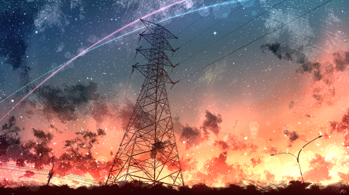 Electric tower against a colorful sunset sky