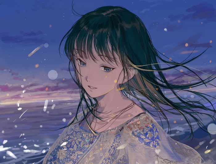 Girl with black hair by the sea at dusk