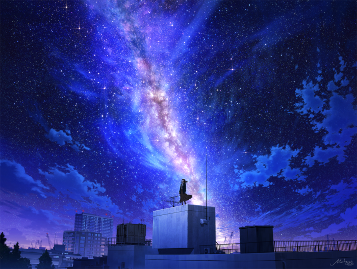 Person on rooftop looking at the Milky Way