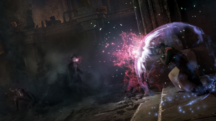 Hogwarts Legacy characters casting spells in a dark ruin