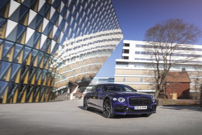 Bentley Flying Spur parked near modern architecture
