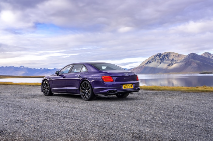 Purple Bentley Flying Spur parked by a lake