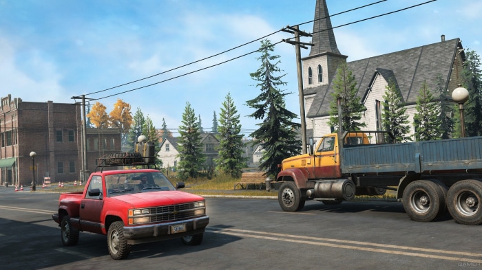 Red pickup truck and yellow truck in SnowRunner