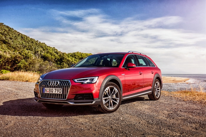 Red Audi A4 Allroad Quattro parked by the sea