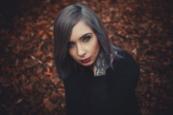 Woman with tattoos and grey hair