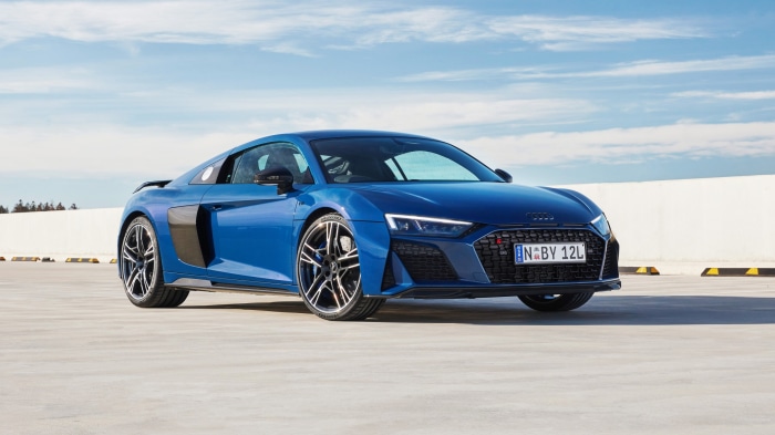 Blue Audi R8 V10 parked on a concrete surface
