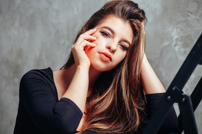 Model posing against a textured background
