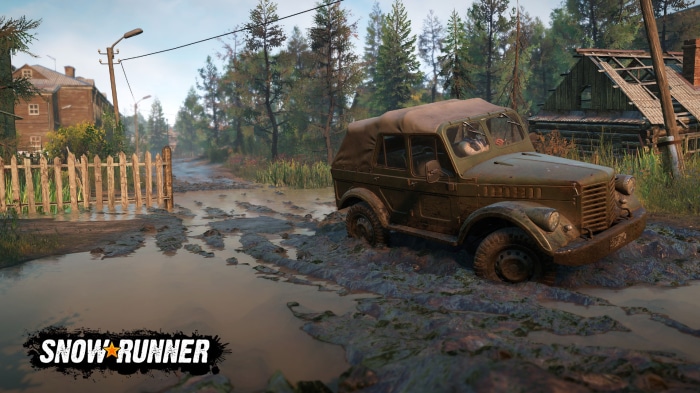 SnowRunner game screenshot with muddy road and vintage vehicle