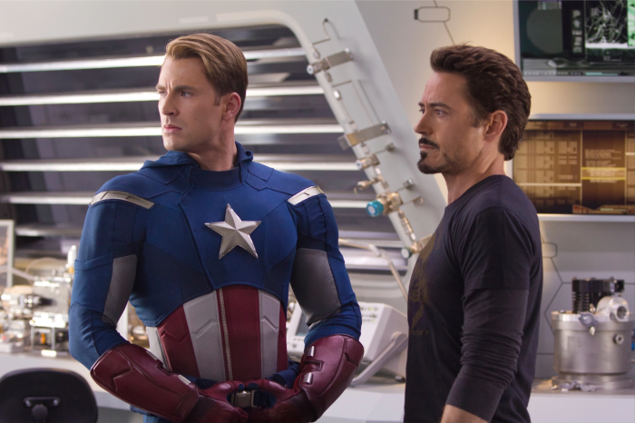 Captain America and Iron Man in a lab