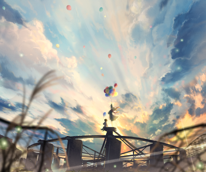 Children holding balloons on a Ferris wheel