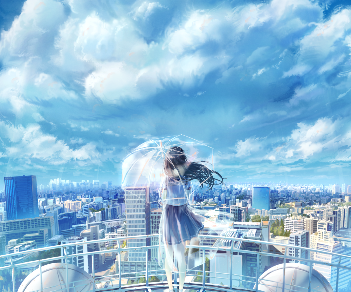 Girl with umbrella overlooking city