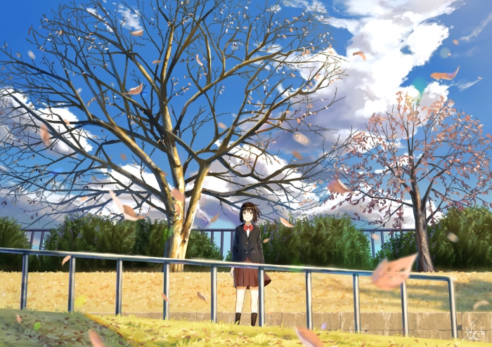 Girl in school uniform under a tree