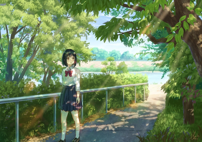 Girl in school uniform by a river